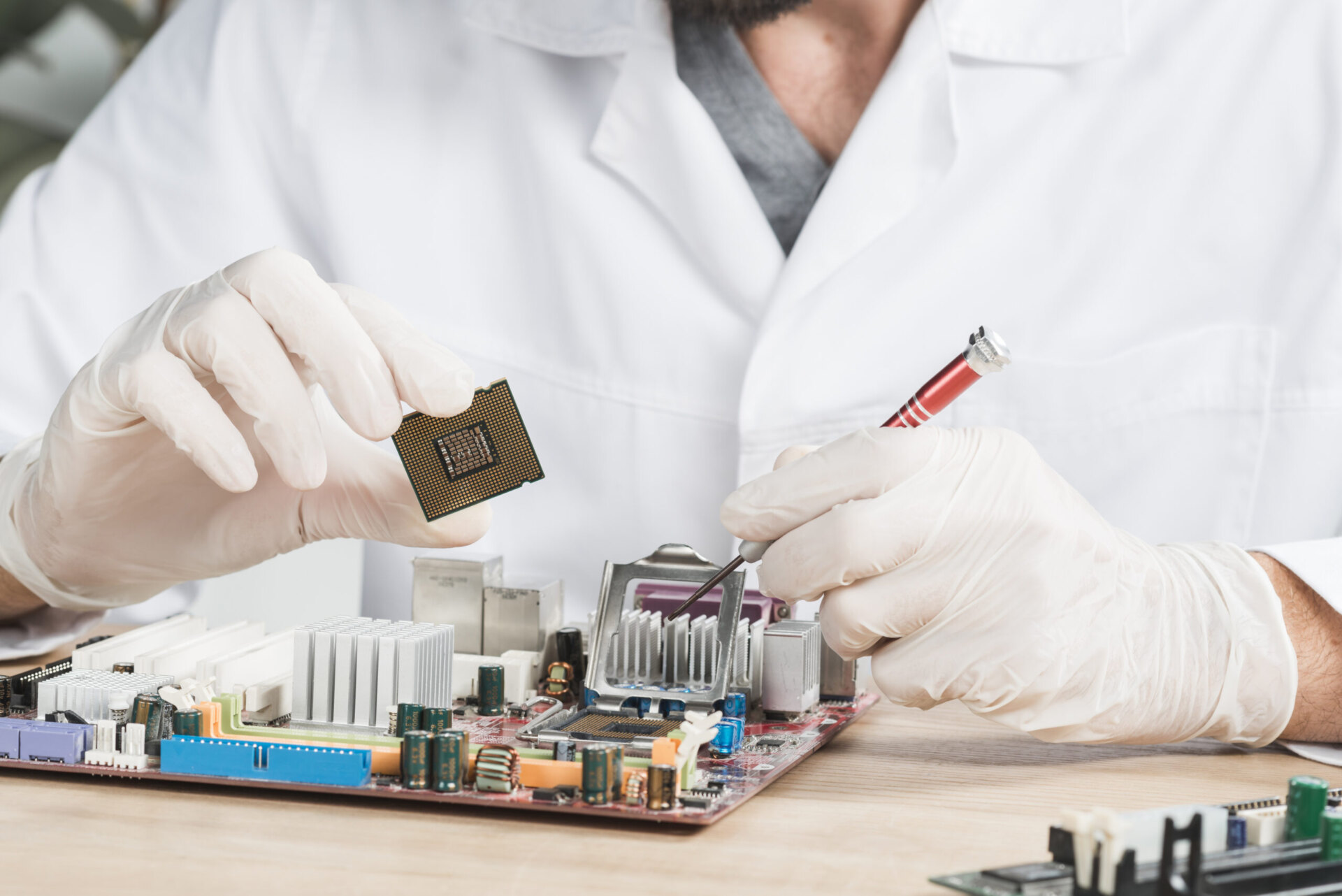 Close-up male technician holding computer chip